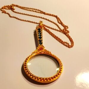 Joan Rivers gold lorgnette necklace with blue crystals